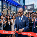 Diomede Sabushimike CEO of Top AI Africa cutting ribbon at grand opening of Africa AI Innovation Hub with officials and tech professionals